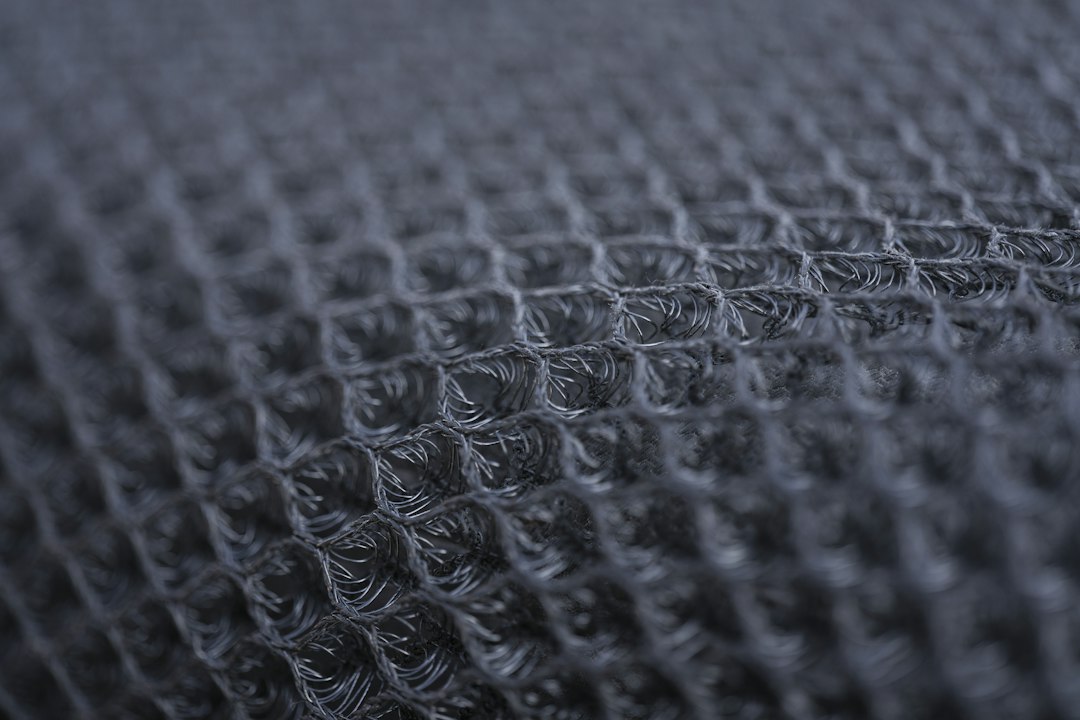 Close-up of a gray synthetic mesh fabric